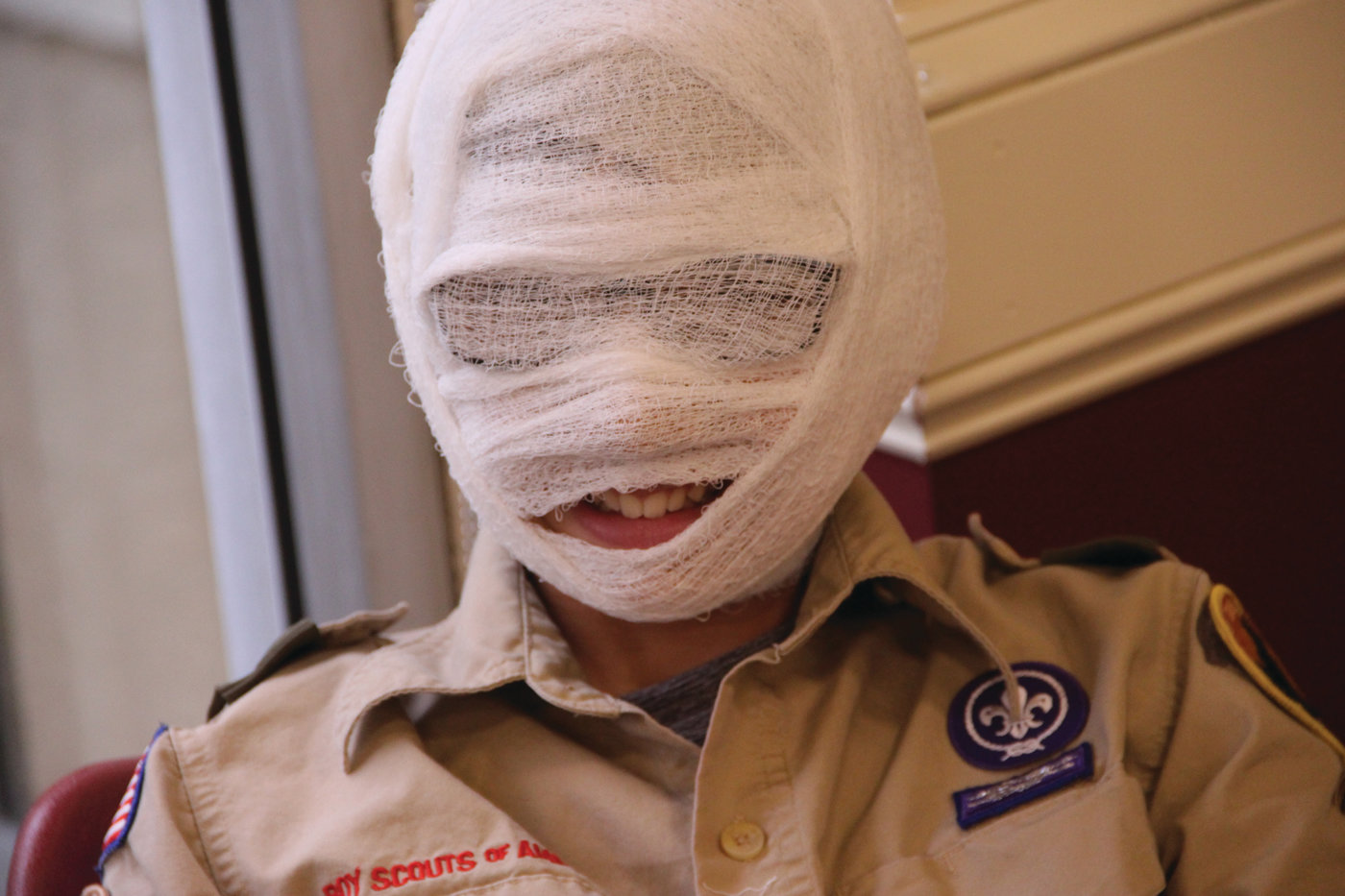 WRAPPED UP: One of the scouts in the first aid class (we couldn’t identify him) couldn’t resist using gauze for a cause